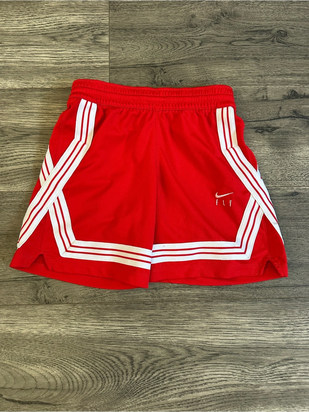 Nike Red Athletic Shorts with White Stripe Accents